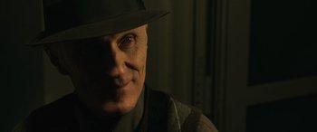 Movie still from “John Wick” (2014), directed by Chad Stahelski – An older man wearing a hat and looking at the camera; Close Up shot, Over the shoulder angle