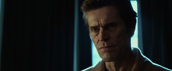 Movie still from “John Wick” (2014), directed by Chad Stahelski – A person wearing a white shirt; Close Up shot, Over the shoulder angle