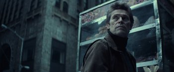 Movie still from “John Wick” (2014), directed by Chad Stahelski – A man standing in front of a food stand; Close Up shot, Low angle