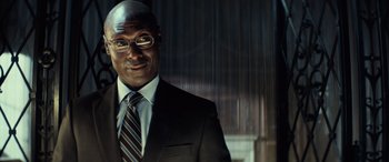 Movie still from “John Wick” (2014), directed by Chad Stahelski – A person wearing a suit and tie; Close Up shot, Low angle