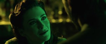 Movie still from “John Wick” (2014), directed by Chad Stahelski – A woman's face in green light; Close Up shot, Over the shoulder angle