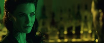 Movie still from “John Wick” (2014), directed by Chad Stahelski – A person in a green room; Close Up shot, Over the shoulder angle