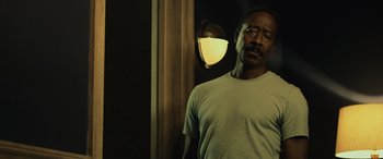 Movie still from “John Wick” (2014), directed by Chad Stahelski – A man standing in front of a wall with a light on it; Close Up shot, Low angle