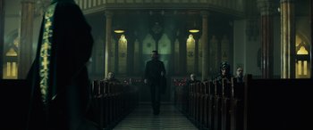 Movie still from “John Wick” (2014), directed by Chad Stahelski – A man walking down the aisle of a church; Wide shot, Low angle