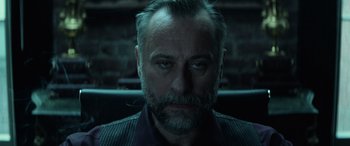 Movie still from “John Wick” (2014), directed by Chad Stahelski – A person with a beard; Close Up shot, Low angle