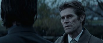 Movie still from “John Wick” (2014), directed by Chad Stahelski – A man in a suit talking to a woman in a suit; Close Up shot, Over the shoulder angle