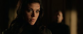 Movie still from “John Wick” (2014), directed by Chad Stahelski – A person wearing a black shirt; Close Up shot, Over the shoulder angle