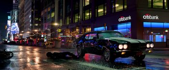 Movie still from “John Wick: Chapter 2” (2017), directed by Chad Stahelski – A car parked on the side of the road at night; Wide shot, High angle