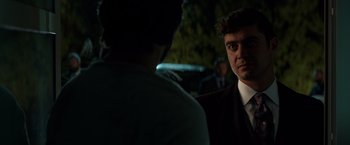 Movie still from “John Wick: Chapter 2” (2017), directed by Chad Stahelski – A man in a business suit is talking to another man in a business suit; Close Up shot, Over the shoulder angle