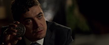 Movie still from “John Wick: Chapter 2” (2017), directed by Chad Stahelski – A person wearing a suit and tie; Close Up shot, Over the shoulder angle