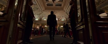 Movie still from “John Wick: Chapter 2” (2017), directed by Chad Stahelski – A group of people standing in a room; Extreme Wide shot, Low angle