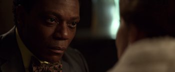 Movie still from “John Wick: Chapter 2” (2017), directed by Chad Stahelski – A person looking at the camera; Close Up shot, Over the shoulder angle