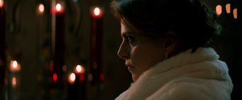 Movie still from “John Wick: Chapter 2” (2017), directed by Chad Stahelski – A person wearing a white coat; Close Up shot, Over the shoulder angle