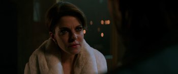 Movie still from “John Wick: Chapter 2” (2017), directed by Chad Stahelski – A person wearing a white coat; Close Up shot, Over the shoulder angle