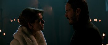 Movie still from “John Wick: Chapter 2” (2017), directed by Chad Stahelski – A man and a woman looking at one another; Close Up shot, Over the shoulder angle
