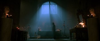 Movie still from “John Wick: Chapter 2” (2017), directed by Chad Stahelski – A man standing in front of an altar in a church; Wide shot, Low angle