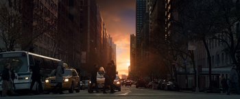 Movie still from “John Wick: Chapter 2” (2017), directed by Chad Stahelski – A city street with cars and people on the sidewalk; Extreme Wide shot, Low angle