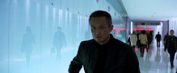 Movie still from “John Wick: Chapter 2” (2017), directed by Chad Stahelski – A man in a black shirt is standing in front of a wall; Close Up shot, Low angle