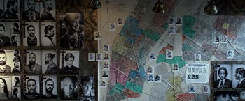 Movie still from “John Wick: Chapter 2” (2017), directed by Chad Stahelski – A wall with a map of a city on it; Extreme Close Up shot, High angle