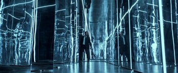 Movie still from “John Wick: Chapter 2” (2017), directed by Chad Stahelski – A man in a suit is standing in a room with mirrors; Wide shot, Low angle