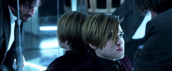 Movie still from “John Wick: Chapter 2” (2017), directed by Chad Stahelski – A couple of people that are looking at something; Close Up shot, Over the shoulder angle