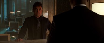 Movie still from “John Wick: Chapter 2” (2017), directed by Chad Stahelski – A man looking at himself in the mirror; Medium shot, Over the shoulder angle