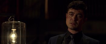 Movie still from “John Wick: Chapter 2” (2017), directed by Chad Stahelski – A person wearing a suit and tie; Close Up shot, Over the shoulder angle