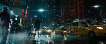 Movie still from “John Wick: Chapter 3 - Parabellum” (2019), directed by Chad Stahelski – A man walking a dog in the rain in front of taxis; Extreme Wide shot, Low angle