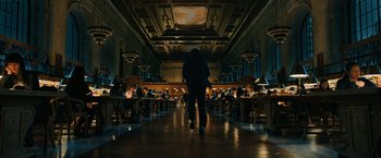 Movie still from “John Wick: Chapter 3 - Parabellum” (2019), directed by Chad Stahelski – A man walking down a hallway in a library; Extreme Wide shot, Low angle
