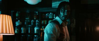 Movie still from “John Wick: Chapter 3 - Parabellum” (2019), directed by Chad Stahelski – A man in a white dress shirt and a tie; Close Up shot, Over the shoulder angle