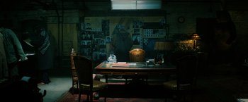 Movie still from “John Wick: Chapter 3 - Parabellum” (2019), directed by Chad Stahelski – A room filled with furniture and pictures on the wall; Extreme Wide shot, High angle