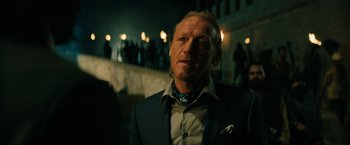 Movie still from “John Wick: Chapter 3 - Parabellum” (2019), directed by Chad Stahelski – A person wearing a suit and tie; Close Up shot, Over the shoulder angle