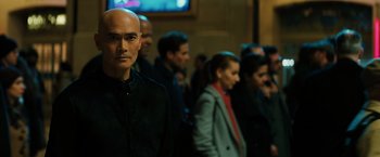 Movie still from “John Wick: Chapter 3 - Parabellum” (2019), directed by Chad Stahelski – A group of people standing in a room; Close Up shot, Low angle