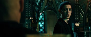 Movie still from “John Wick: Chapter 3 - Parabellum” (2019), directed by Chad Stahelski – A man standing in front of a stained glass window; Medium shot, Low angle