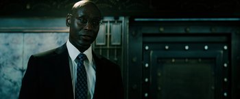 Movie still from “John Wick: Chapter 3 - Parabellum” (2019), directed by Chad Stahelski – A man in a suit and tie standing in front of a door; Close Up shot, Low angle