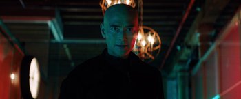 Movie still from “John Wick: Chapter 3 - Parabellum” (2019), directed by Chad Stahelski – A man with a bald head is standing in front of lights; Close Up shot, Low angle