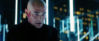 Movie still from “John Wick: Chapter 3 - Parabellum” (2019), directed by Chad Stahelski – A man with a bald head is looking at the camera; Close Up shot, Low angle