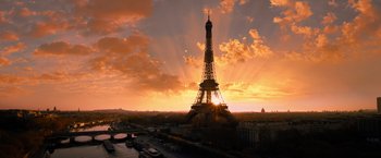 Movie still from “John Wick: Chapter 4” (2023), directed by Chad Stahelski – The sun is setting behind the eiffel tower; Extreme Wide shot, Low angle