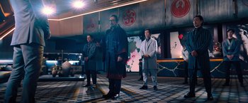 Movie still from “John Wick: Chapter 4” (2023), directed by Chad Stahelski – A group of people standing in a room; Wide shot, Low angle