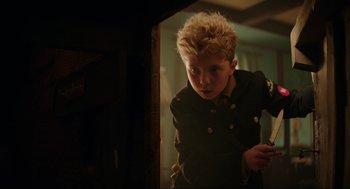 Movie still from “Jojo Rabbit” (2019), directed by Taika Waititi – A young boy is looking into a mirror; Close Up shot, Over the shoulder angle