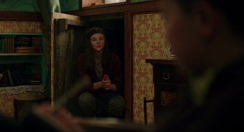Movie still from “Jojo Rabbit” (2019), directed by Taika Waititi – A woman sitting on a chair in front of a window; Medium shot, Over the shoulder angle