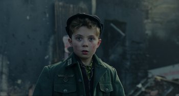 Movie still from “Jojo Rabbit” (2019), directed by Taika Waititi – A young boy wearing a green jacket and a hat; Close Up shot, Over the shoulder angle