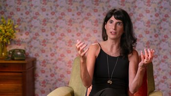 Movie still from “Judy Blume Forever” (2023), directed by Leah Wolchok – A woman sitting in a chair talking to someone; Medium shot, Low angle