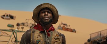 Movie still from “Jumanji: The Next Level” (2019), directed by Jake Kasdan – A man with a cowboy hat and a beard; Close Up shot, Low angle