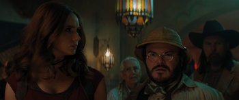 Movie still from “Jumanji: The Next Level” (2019), directed by Jake Kasdan – A man and a woman standing next to each other in a room; Close Up shot, Low angle