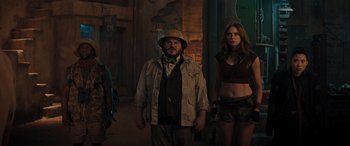 Movie still from “Jumanji: The Next Level” (2019), directed by Jake Kasdan – A man and a woman standing next to each other; Medium shot, Over the shoulder angle