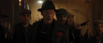 Movie still from “Jumanji: The Next Level” (2019), directed by Jake Kasdan – A group of men standing next to each other in a room; Close Up shot, Low angle