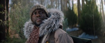 Movie still from “Jumanji: The Next Level” (2019), directed by Jake Kasdan – A man wearing a coat and a hat with fur; Close Up shot, Low angle