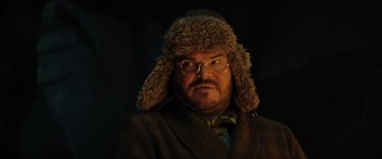 Movie still from “Jumanji: The Next Level” (2019), directed by Jake Kasdan – A man wearing a fur hat and a coat; Close Up shot, Low angle