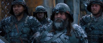 Movie still from “Jumanji: The Next Level” (2019), directed by Jake Kasdan – Two men dressed in metal armor and helmets; Close Up shot, Low angle